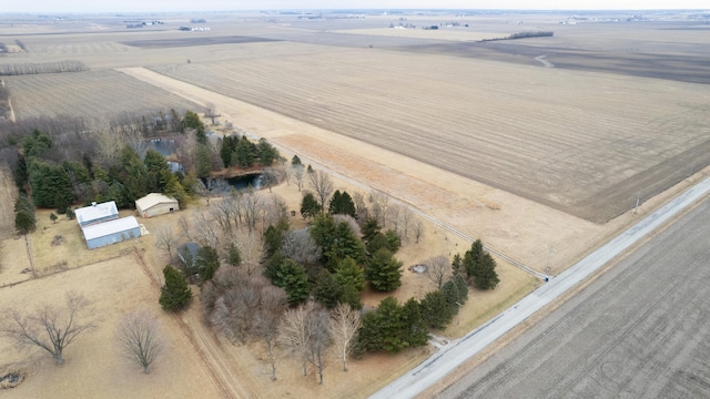 birds eye view of property with a rural view