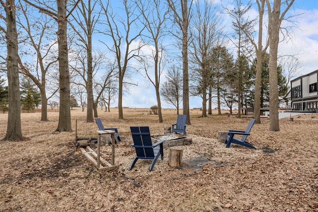 view of yard featuring a fire pit