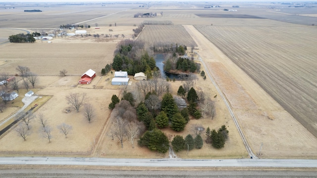 birds eye view of property with a rural view