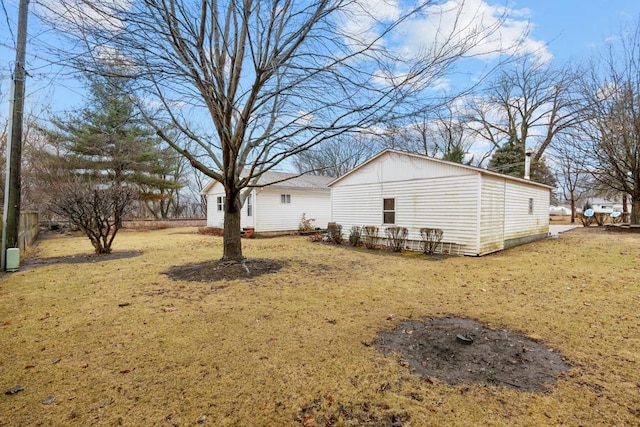 view of home's exterior featuring a lawn