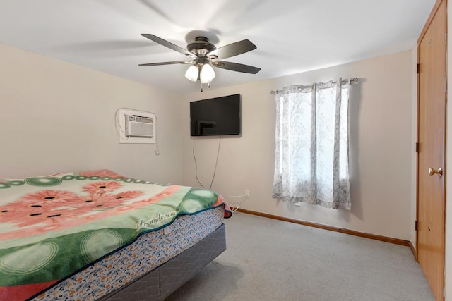 bedroom featuring ceiling fan, an AC wall unit, carpet, and baseboards