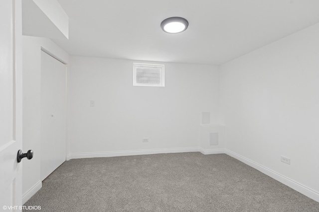 spare room with carpet floors and baseboards