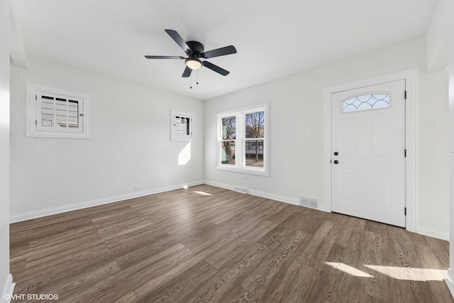 foyer entrance featuring wood finished floors, baseboards, and ceiling fan