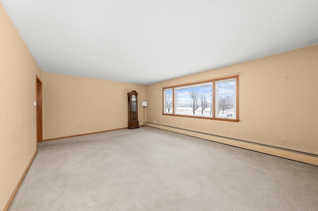 empty room featuring light carpet, a baseboard radiator, and baseboards