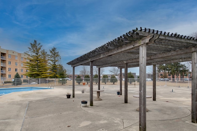 surrounding community with a patio area, fence, a swimming pool, and a pergola