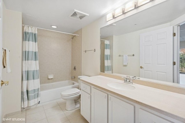 full bathroom featuring visible vents, toilet, shower / tub combo, vanity, and tile patterned floors