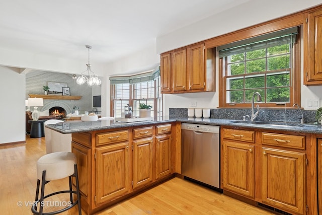 1109 E Gartner Rd, Naperville, IL 60540 - kitchen featuring stainless steel dishwasher, brown cabinetry, and light wood-style flooring