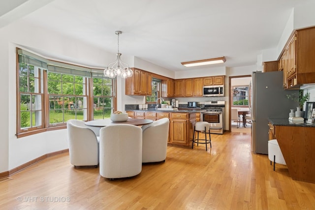 1109 E Gartner Rd, Naperville, IL 60540 - dining space featuring light wood finished floors and a chandelier