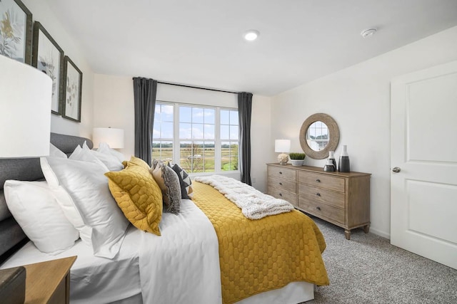 bedroom with light colored carpet