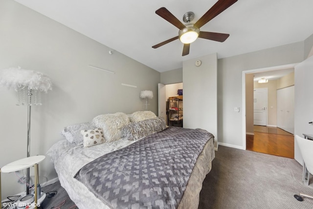 carpeted bedroom featuring ceiling fan and baseboards