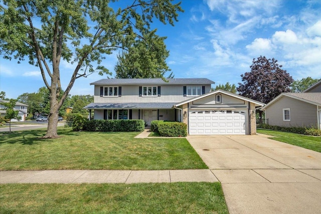 traditional-style home with a garage, driveway, and a front lawn