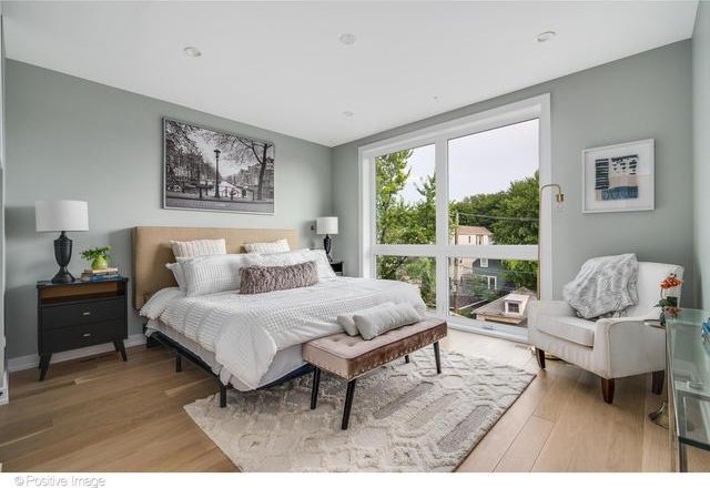 bedroom with light wood finished floors