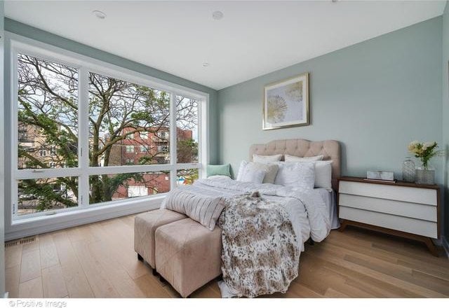 bedroom with wood finished floors