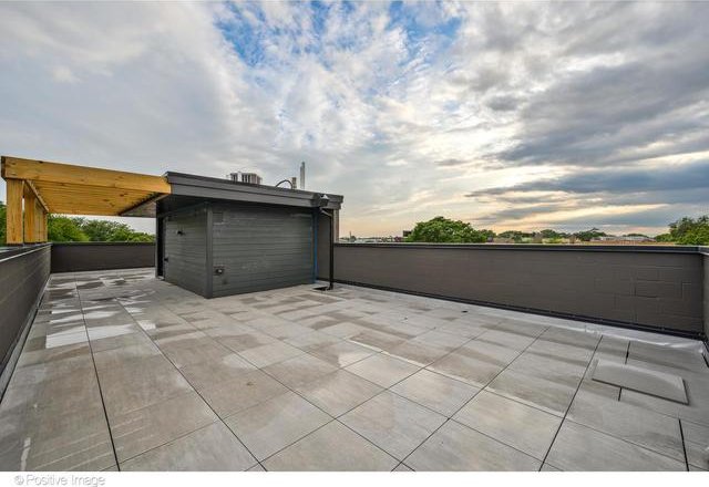 view of patio terrace at dusk