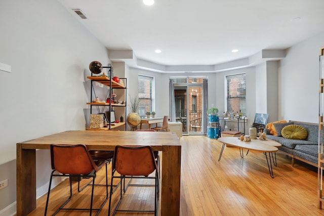 dining area with recessed lighting, visible vents, baseboards, and hardwood / wood-style flooring