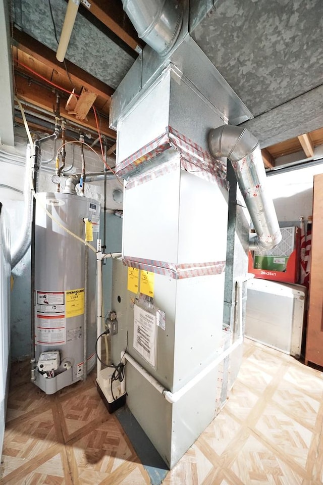 utility room featuring gas water heater