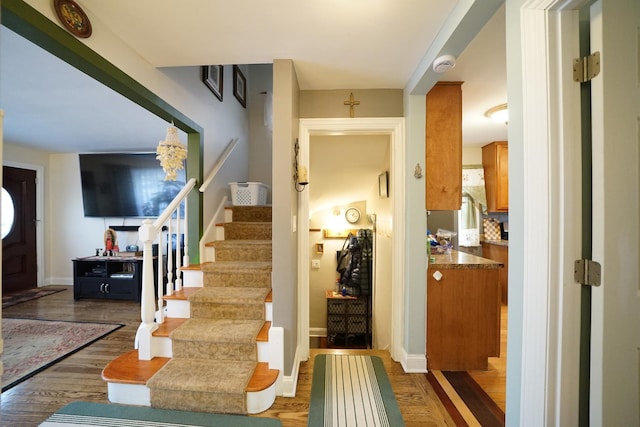 interior space featuring baseboards and wood finished floors