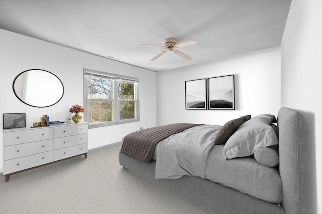 bedroom featuring carpet floors, ceiling fan, and visible vents