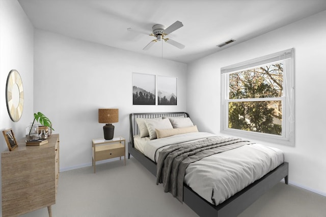 carpeted bedroom featuring baseboards, visible vents, and ceiling fan