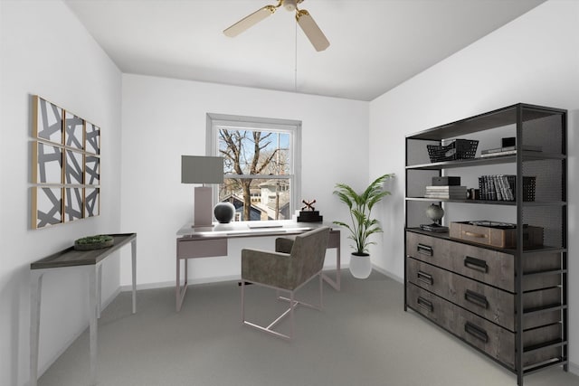 office space with ceiling fan and baseboards