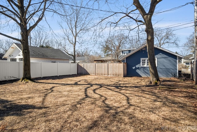 view of yard with a fenced backyard