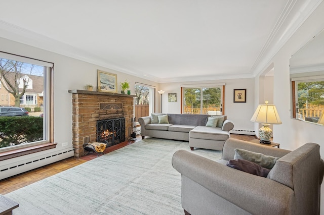 living area with a baseboard heating unit, a fireplace, baseboard heating, and ornamental molding