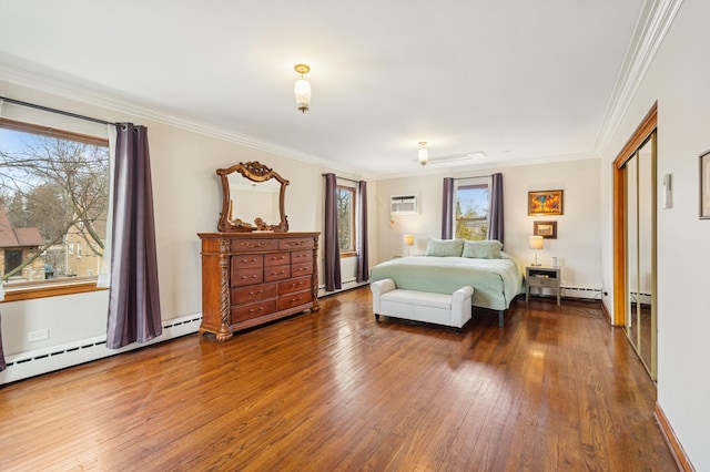 bedroom featuring a wall unit AC, hardwood / wood-style flooring, and multiple windows