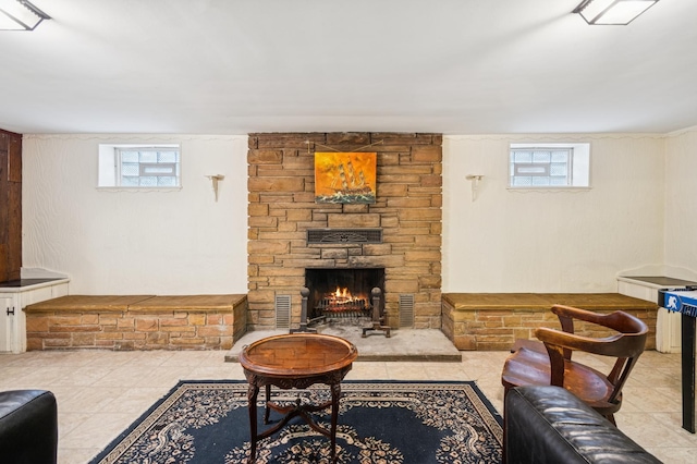 living room with a wealth of natural light, visible vents, and a fireplace