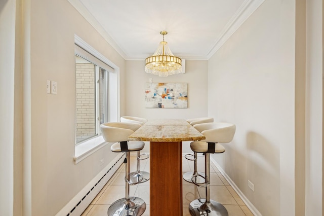 dining space featuring a chandelier, light tile patterned flooring, crown molding, and baseboards