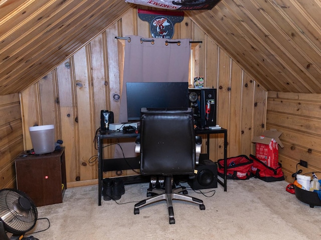 carpeted office space featuring vaulted ceiling and wood walls