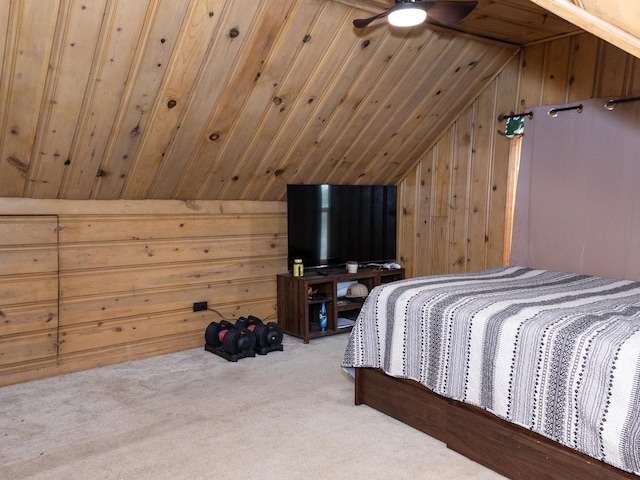 carpeted bedroom with lofted ceiling, wood ceiling, and wood walls