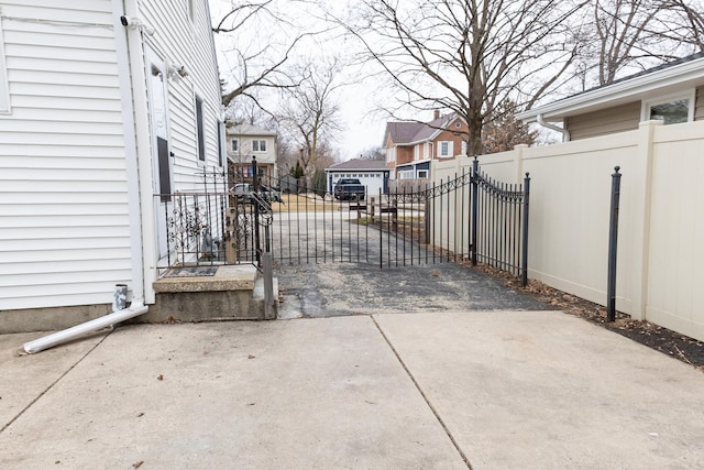 view of gate featuring a residential view and fence