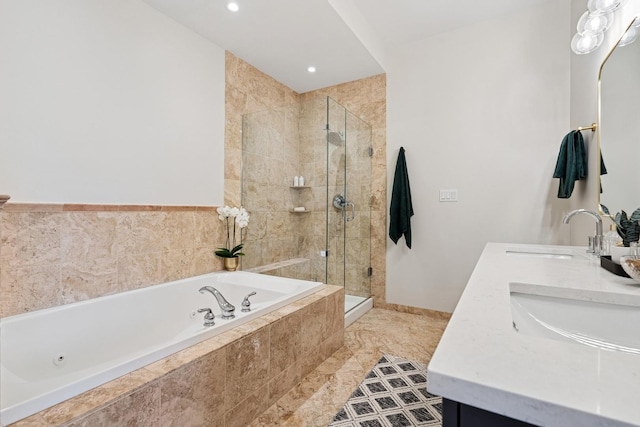 bathroom featuring a sink, a shower stall, a tub with jets, and double vanity