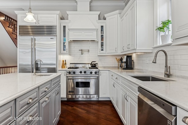 1307 W Wellington Ave, Chicago, IL 60657 - kitchen featuring high end appliances, a sink, backsplash, and crown molding