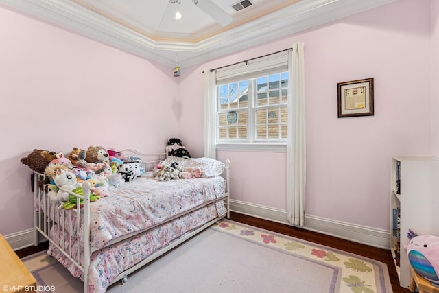 1307 W Wellington Ave, Chicago, IL 60657 - bedroom with ornamental molding, wood finished floors, baseboards, and ceiling fan