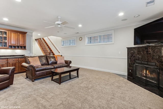 1307 W Wellington Ave, Chicago, IL 60657 - living area with ornamental molding, a ceiling fan, light colored carpet, stairs, and a fireplace with flush hearth