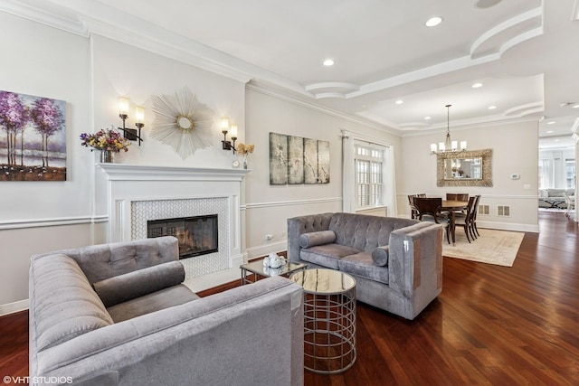 1307 W Wellington Ave, Chicago, IL 60657 - living area featuring dark wood-style flooring, a fireplace, baseboards, a chandelier, and recessed lighting