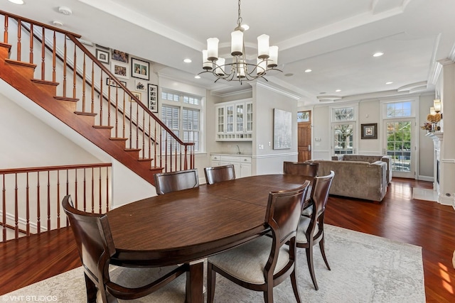1307 W Wellington Ave, Chicago, IL 60657 - dining space featuring a chandelier, crown molding, wood finished floors, recessed lighting, and stairs