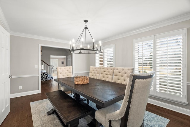 dining room featuring baseboards, stairway, dark wood-style flooring, crown molding, and a chandelier