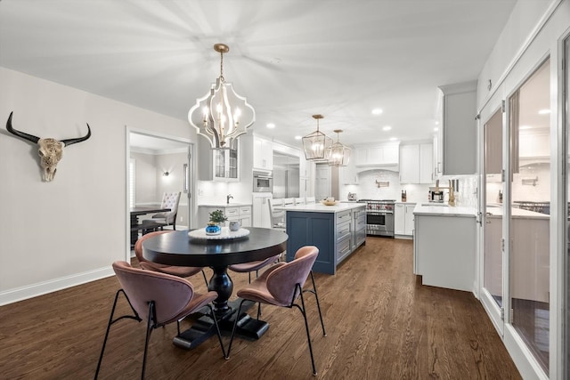 dining space with dark wood-type flooring, recessed lighting, a chandelier, and baseboards