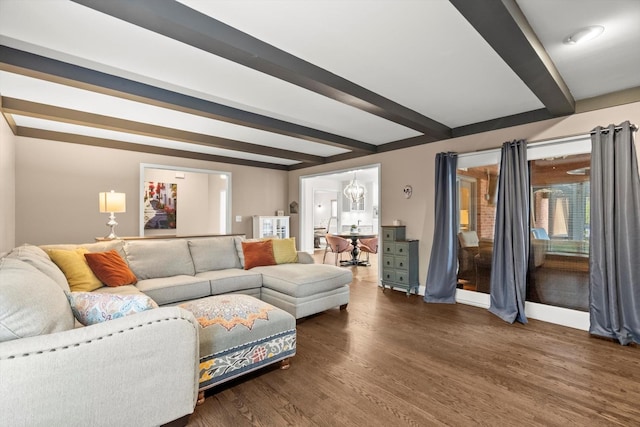 living area with beam ceiling, baseboards, and wood finished floors