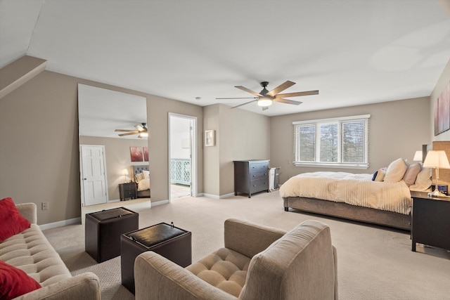 carpeted bedroom featuring baseboards, vaulted ceiling, and a ceiling fan