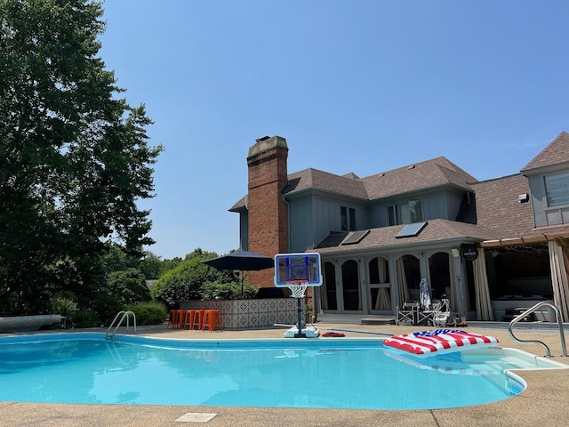 pool with a patio area