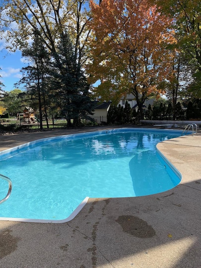 view of pool featuring a fenced in pool, a patio area, and fence