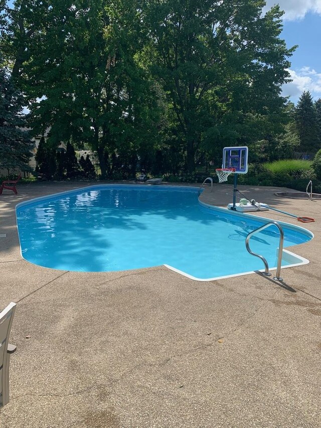 pool with a patio area