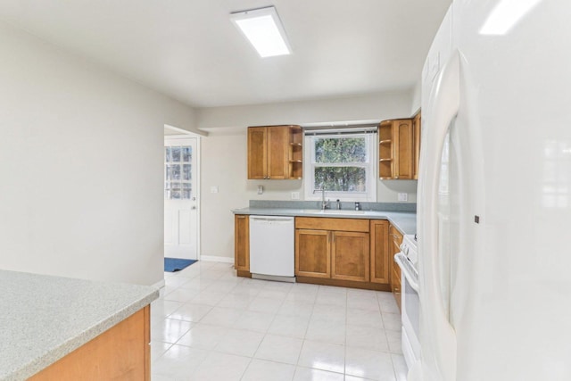 kitchen with white appliances, baseboards, light countertops, open shelves, and brown cabinetry