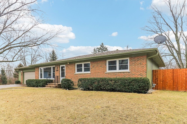 single story home with a garage, brick siding, fence, driveway, and a front lawn