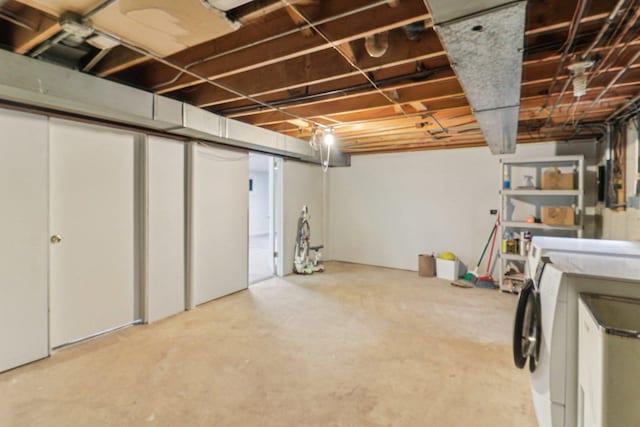 unfinished basement with separate washer and dryer