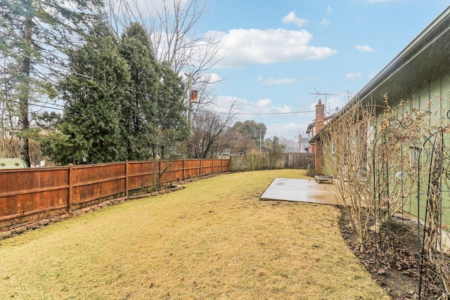 view of yard with a fenced backyard and a patio