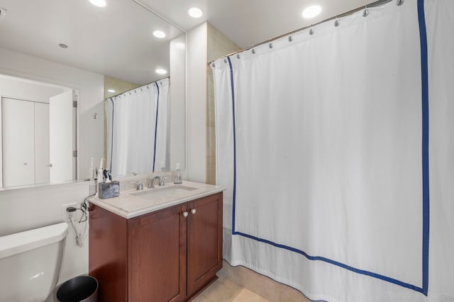 full bathroom with toilet, recessed lighting, and vanity